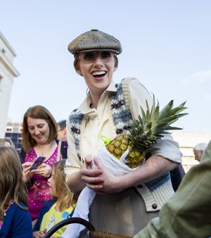 woman holding a pineapple