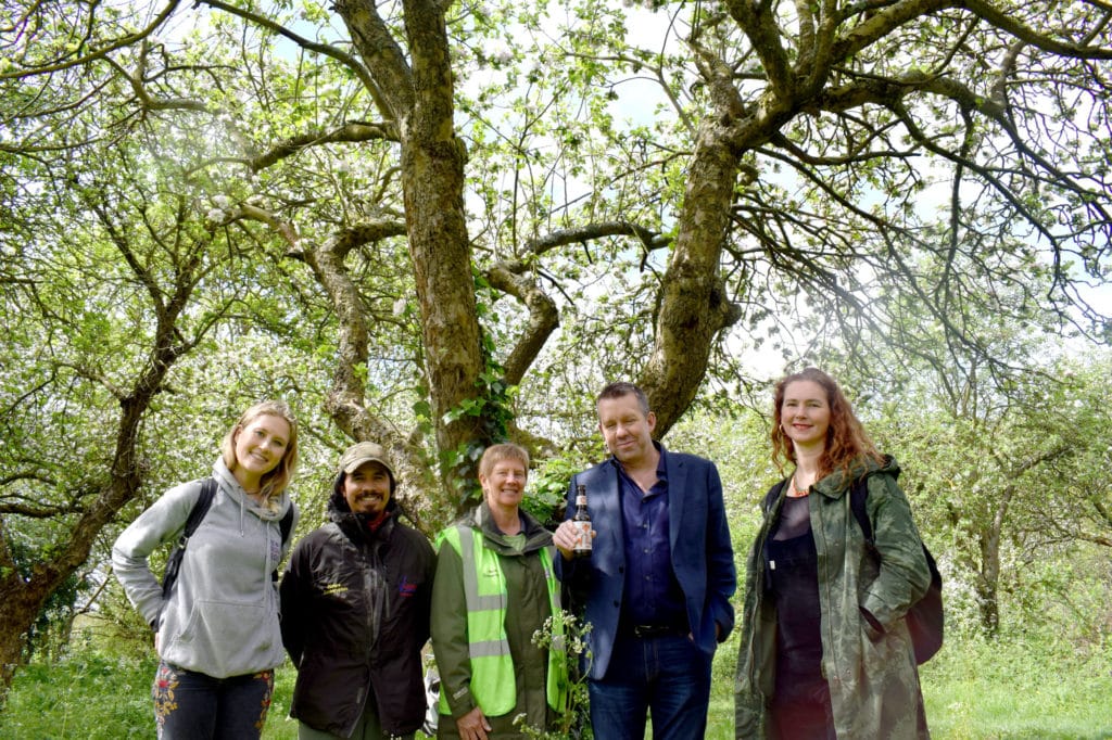 group in park smiling at camera