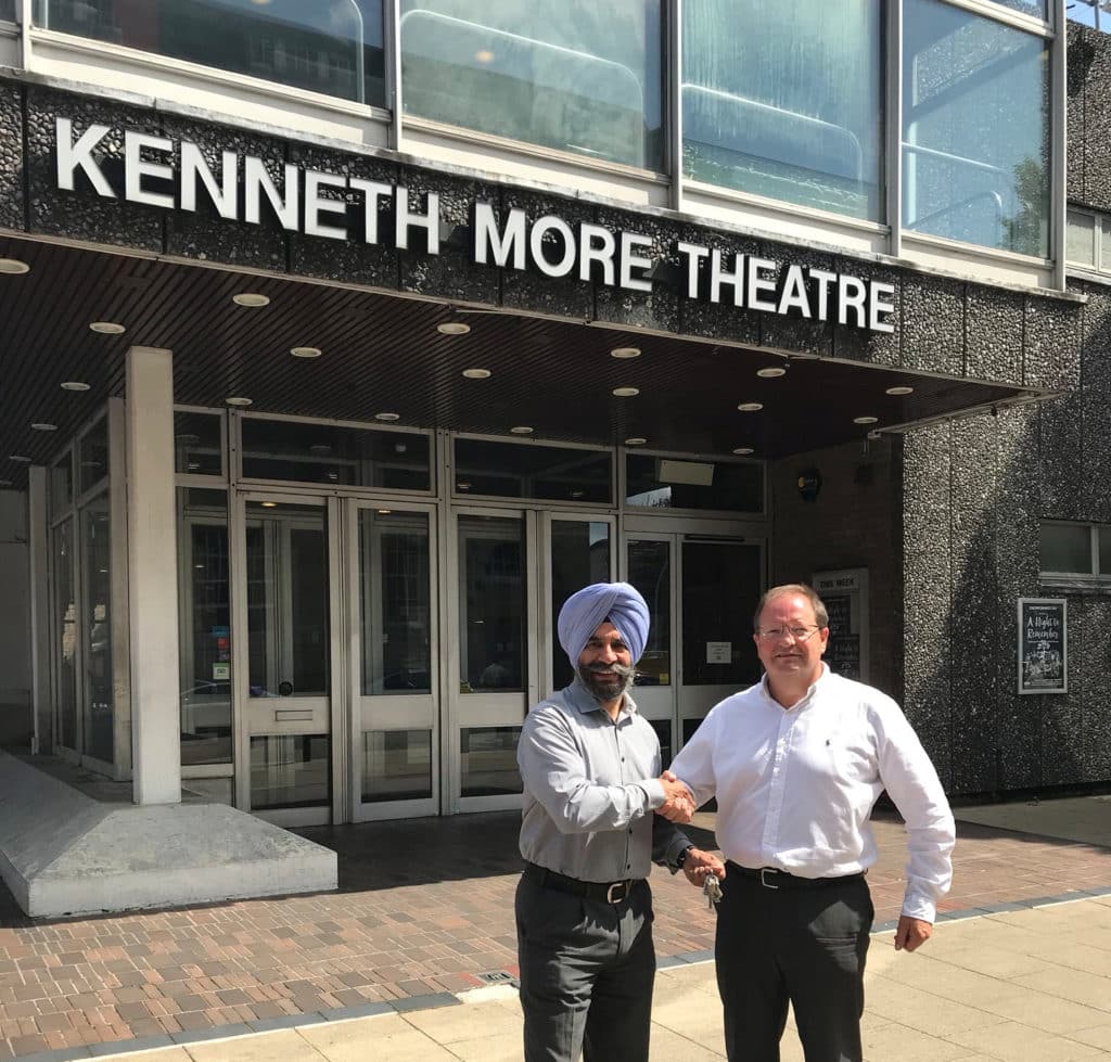 leaders of council and vision shaking hands outside KMT