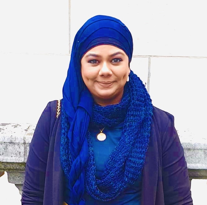 Head and shoulders image of Yashmin dressed in blue