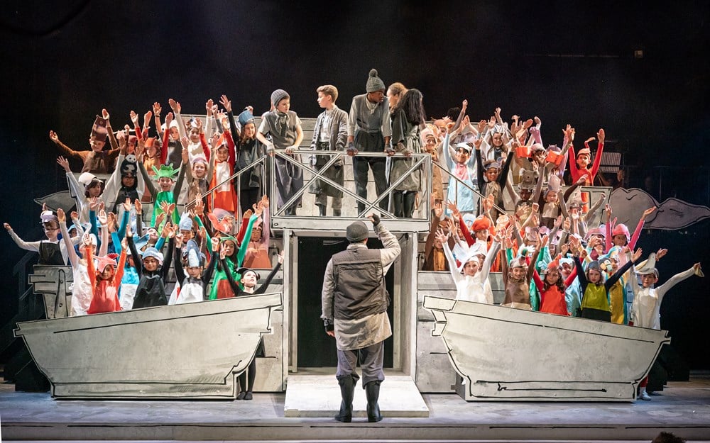 group of children on stage performing
