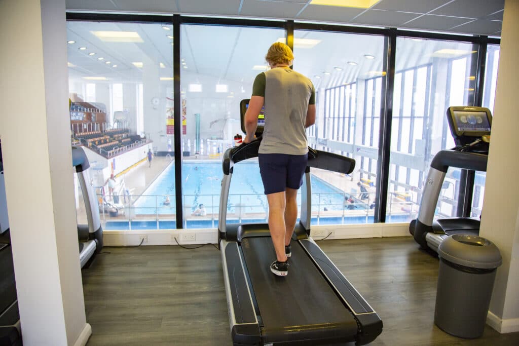 man running on treadmill