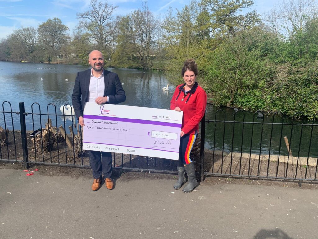 Vision Parks Staff with Swan Sanctuary holding cheque