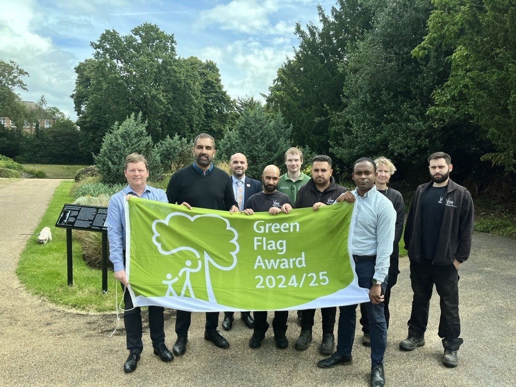Members of the park and local community holding up green flag for 2024